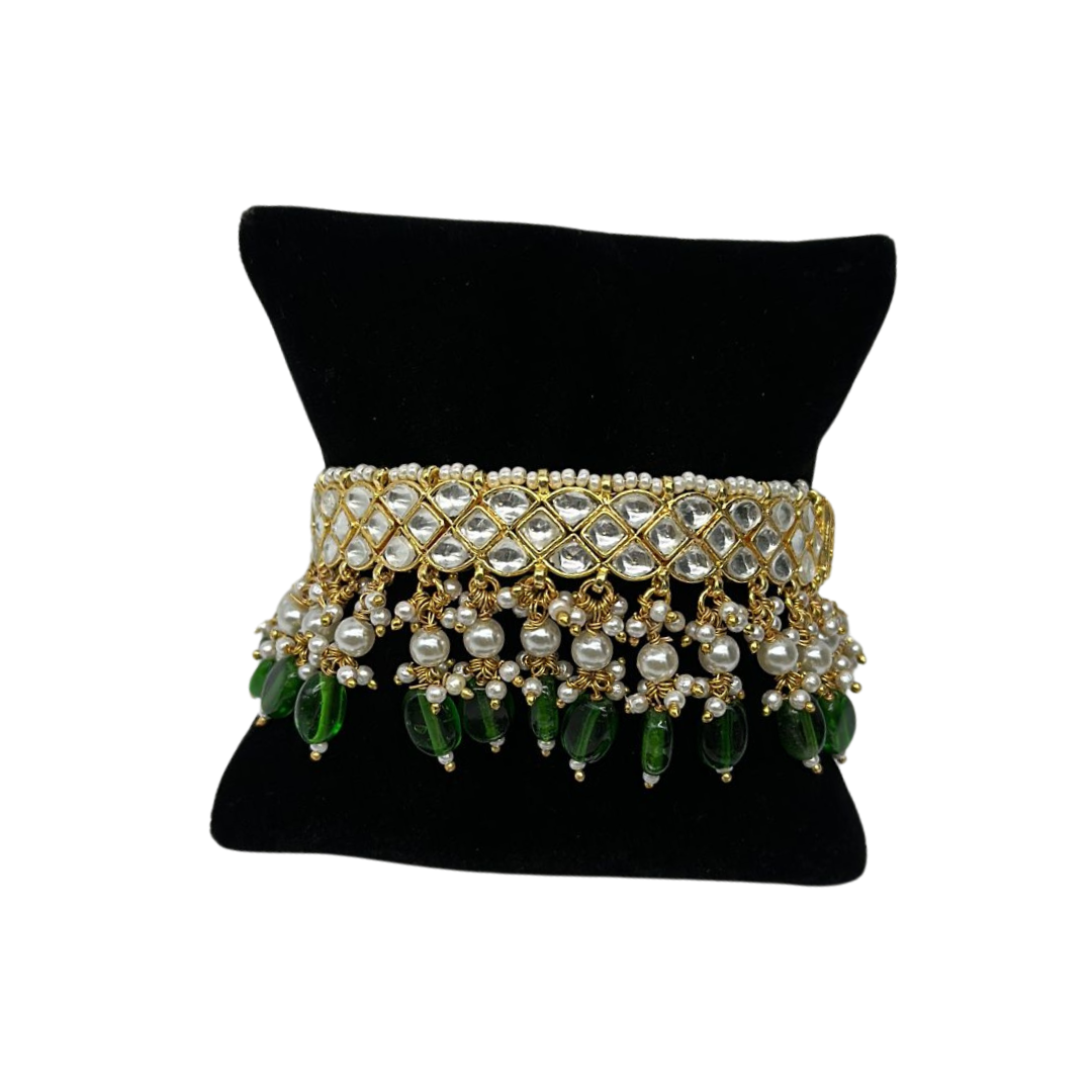 Pair of kundan bangles with lock and pearls and emeralds hanging