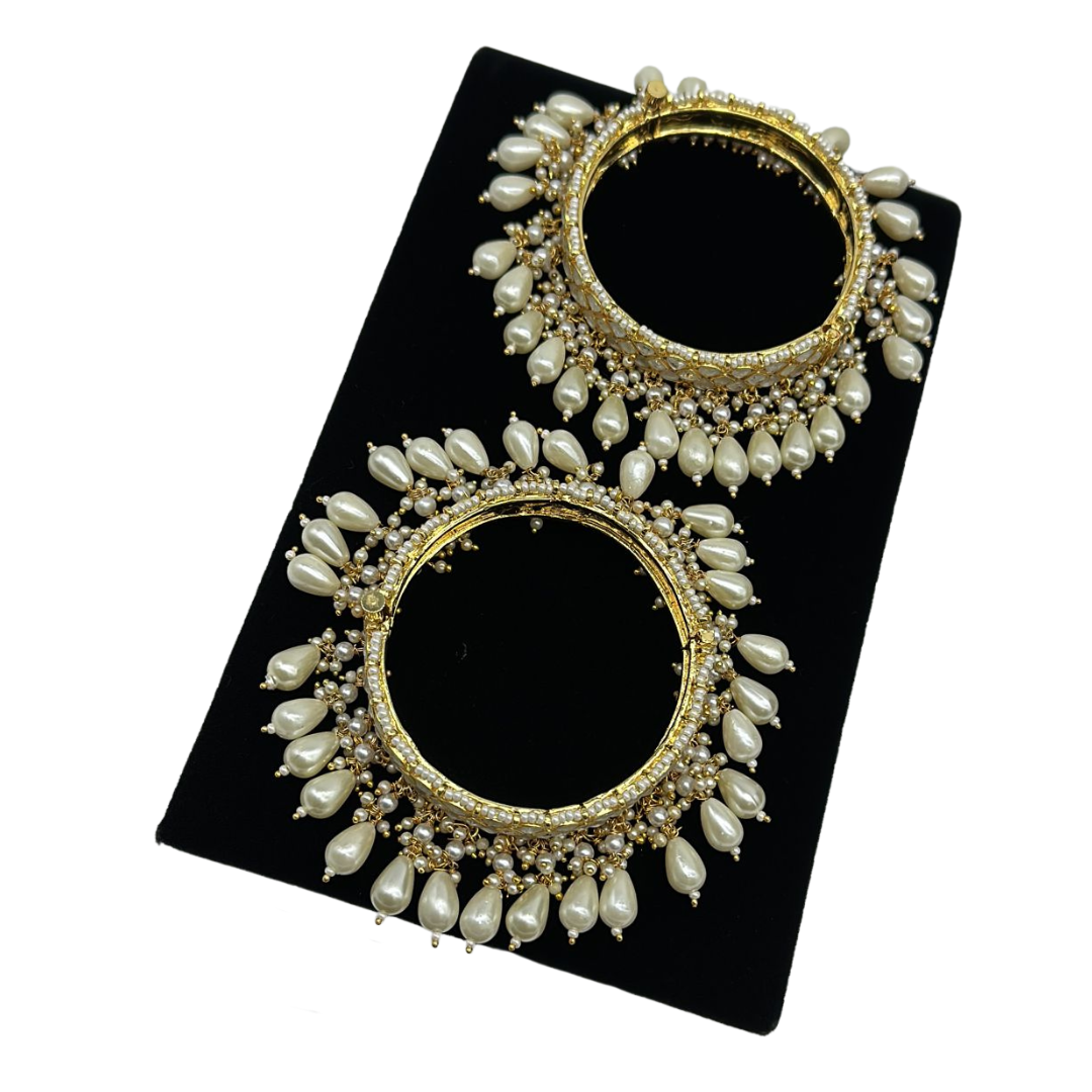 Pair of kundan bangles with lock and pearls hanging
