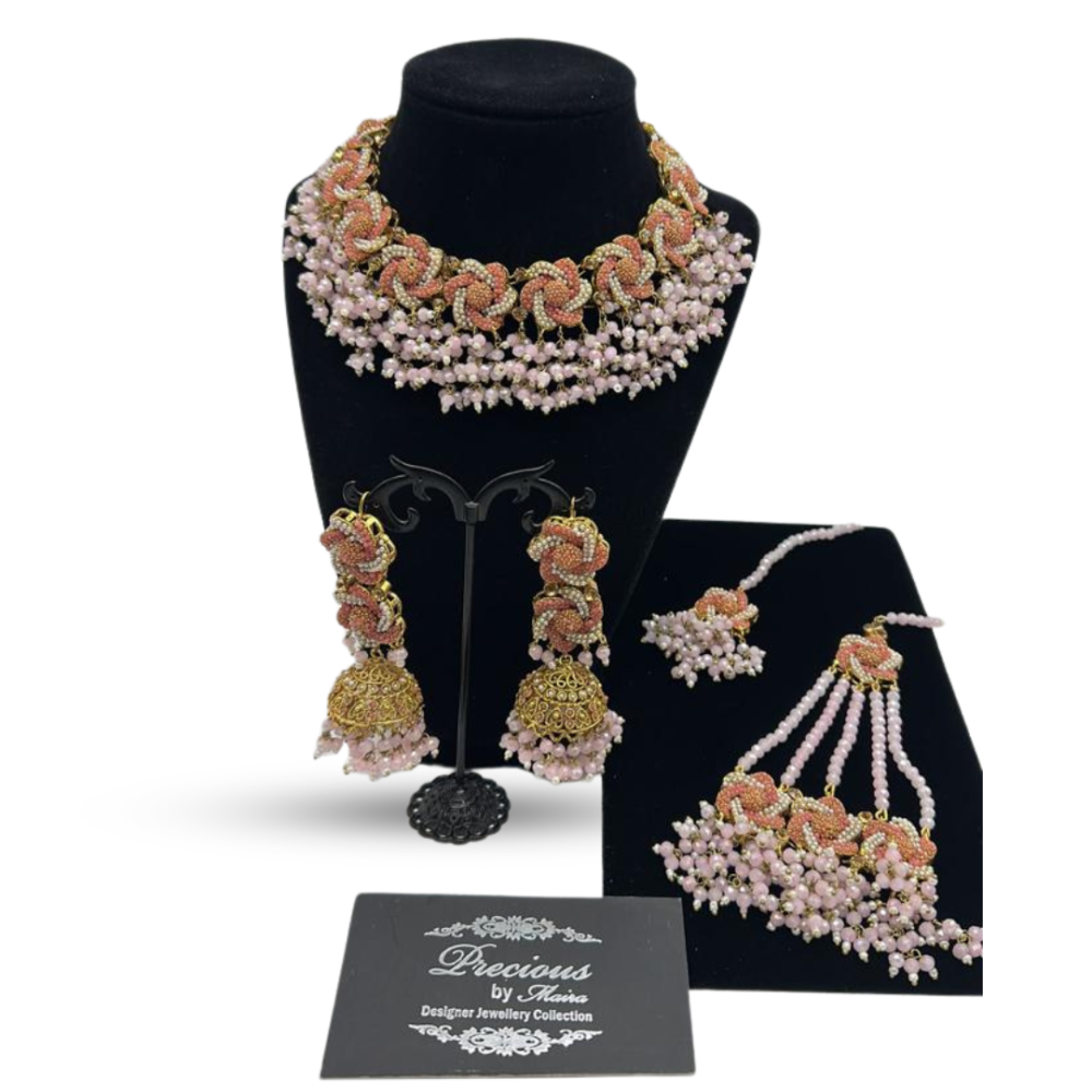 Intricately designed set with pearls and pink finish