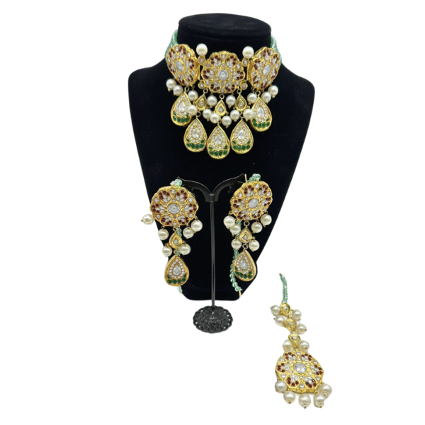 Beautifully crafted kundan set with mint green crystal strands in ruby, emeralds and pearls