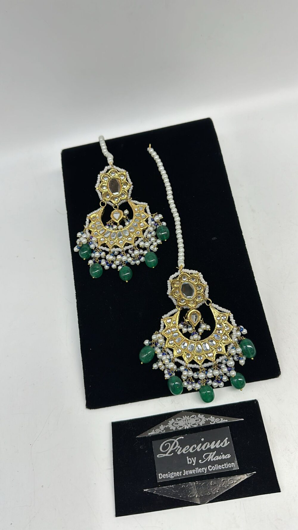 Chand Bali style kundan earrings with pearl and semi precious emeralds droplets