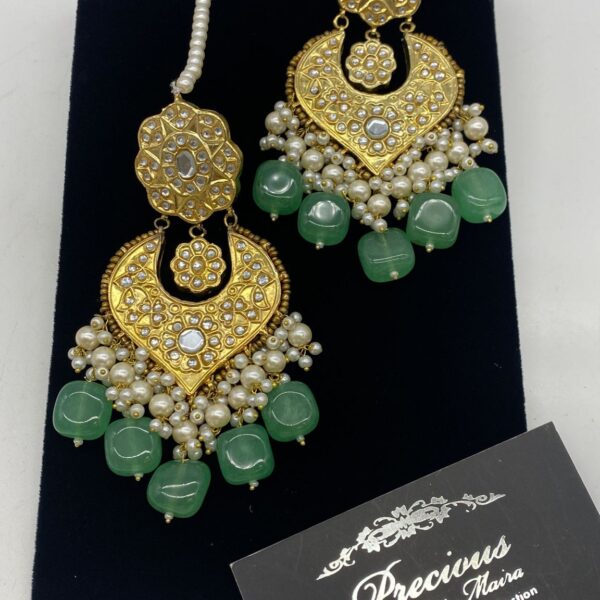 Chand Bali style kundan earrings with chunks of pearl hanging and semi precious emerald droplets